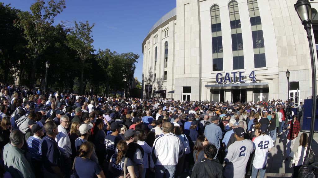 Fans gather outside Yankee Stadium for a free giveaway prior to an afternoon game. | Art or Photo Credit: AP
