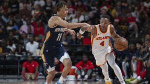 Kobe Bufkin dribbles past a New Orleans Pelicans defender. | Art or Photo Credit: AP