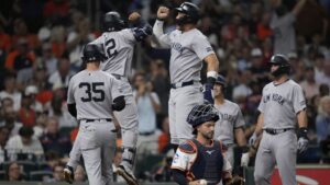 The New York Yankees celebrate a grand slam from Trent Grisham in the fifth inning against the Houston Astros.|Art or Photo Credit: Associated Press