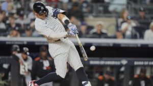 Aaron Judge hits a home run during the third inning against the Detroit Tigers on Thursday in New York to tie Joe DiMaggio for fourth place in Yankees history.|Art or Photo Credit: AP