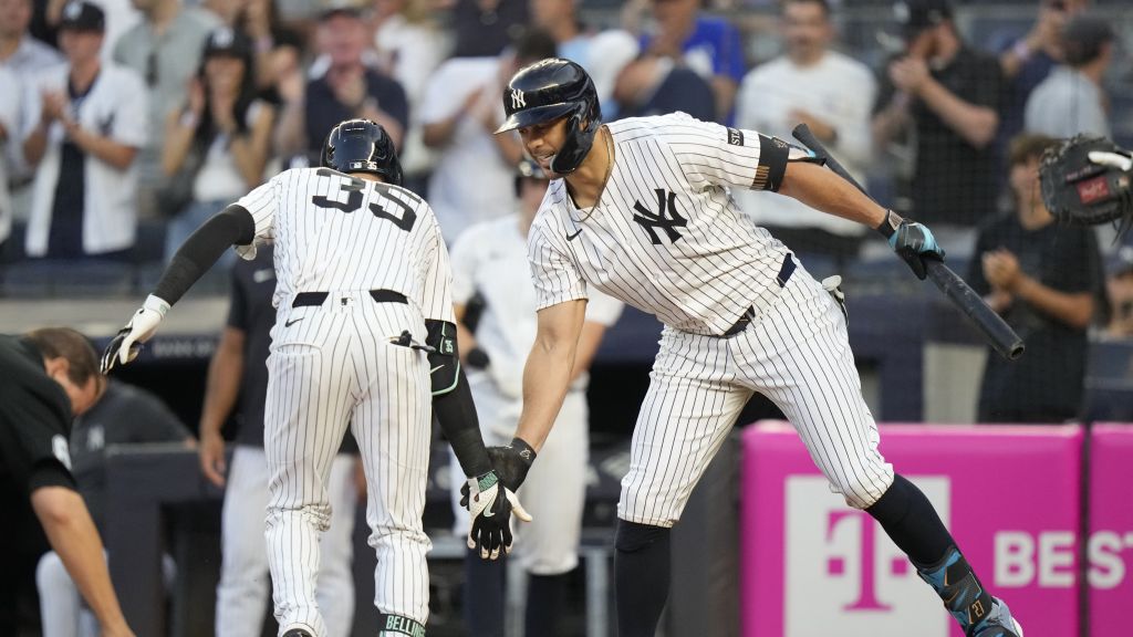 Cody Bellinger and Giancarlo Stanton celebrate after Bellinger hit a solo home run in the first inning to put the New York Yankees on the board against the Minnesota Twins. | Art or Photo Credit: Associated Press